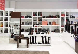 bright and fashionable interior of shoe store in modern mall
